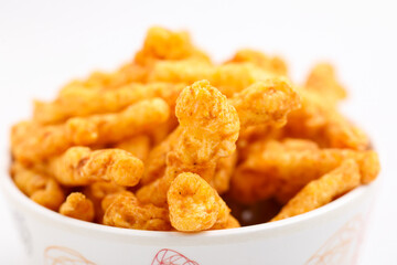 Delicious Homemade kurkure snack on white background.