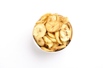 banana chips in bowl on white background.