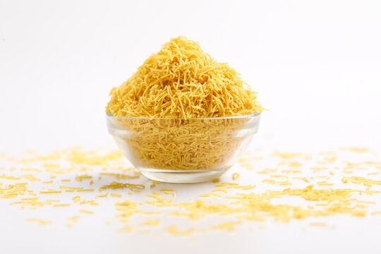 Sev. Besan Sev Indian Namkeen Noodles of chickpea flour. Besan Sev Popular Teatime Snack.