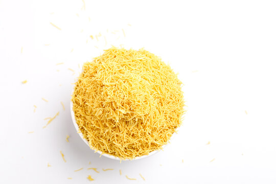 Sev. Besan Sev Indian Namkeen Noodles of chickpea flour. Besan Sev Popular Teatime Snack.