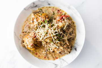 healthy plant-based food, vegan potato bake with dairy-free creamy sauce with chives nutmeg and herbs