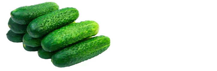Papier peint photo autocollant rond Légumes frais green cucumbers on a white background. ripe gherkins on a table. fresh vegetables on a light texture. the concept of growing cucumbers