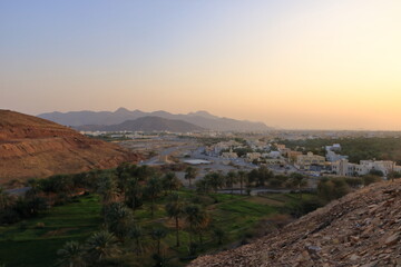 Birkat Al Mouz Ruins and a valley of palm trees