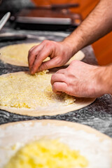 hand of chef baker making pizza at kitchen. The process of making pizza. cooking italian pizza