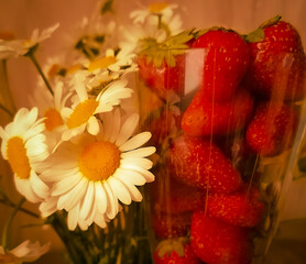 bouquet of daisies and strawberries in a glass