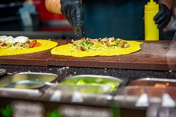 process of preparing traditional Turkish fast food - grilled meat or shawarma or kebab. chef hand cooking food