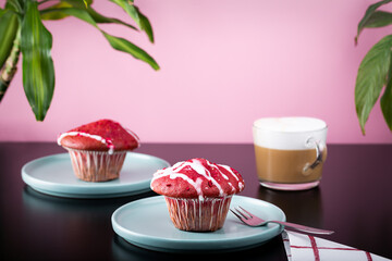 Red velvet cupcake with a cappuccino  in a studio shot