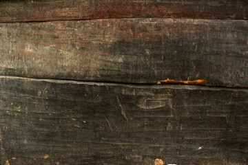 Old grunge wooden desk dark textured background