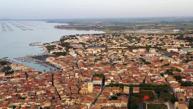 Aerial view of the village of Meze, on a summer day, in Herault in Occitanie, France