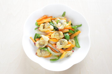 Chinese food, clam and mixed vegetable stir fried on white plate
