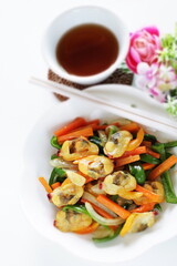 Chinese food, clam and mixed vegetable stir fried on white plate