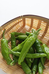 Japanese green pepper in bamboo basket for cooking ingredient