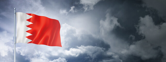 Bahrain flag on a cloudy sky