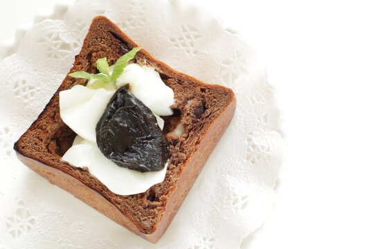Dried plum and yogurt in chocolate bread for healthy breakfast image