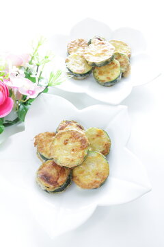Korean food, fried zucchini slices on dish for comfort food image