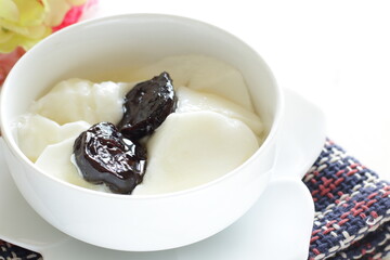 Dried plum and honey on Yogurt for healthy dessert and breakfast