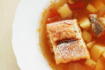 Homemade minestrone soup served with French bread