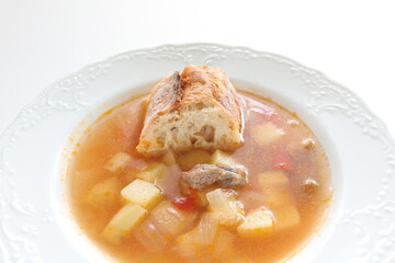 Homemade minestrone soup served with French bread