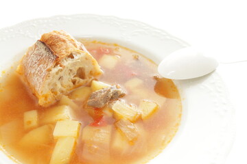 Homemade minestrone soup served with French bread
