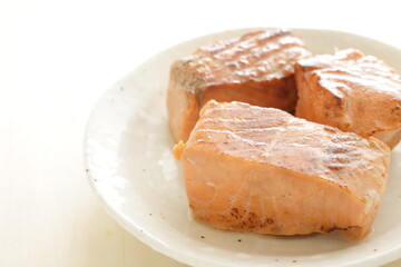Canned food, grilled salmon on dish for emergency food image