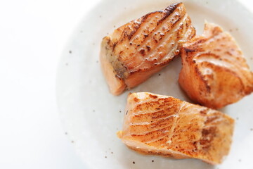 Canned food, grilled salmon on dish for emergency food image