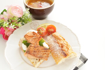 Homemade canned salmon fillet and French bread sandwiches with minestrone soup