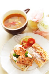 Homemade canned salmon fillet and French bread sandwiches with minestrone soup