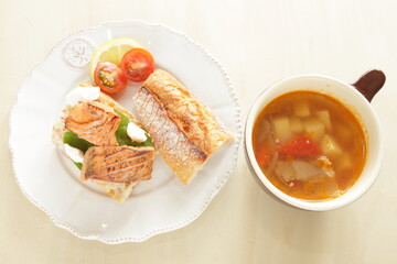 Homemade canned salmon fillet and French bread sandwiches with minestrone soup