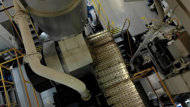  Direction arrows on platform in engine room of ship