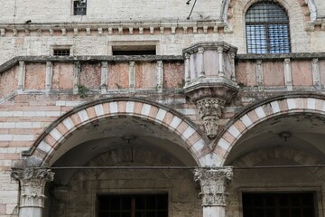 Fototapeta na wymiar Palazzo dei Priori Building Exterior Detail with Arches in Perugia, Umbria, Italy