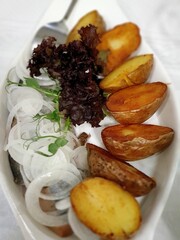 fish with potatoes and vegetables