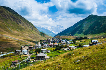 Fototapeta na wymiar Village Ushguli landscape with massive rocky mountains