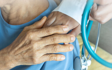 Caregiver with happy elderly senior patient to comfort in outdoor skyscrapper rooftop urban city...