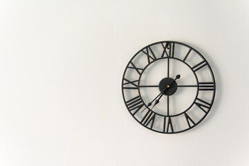 clock on the wall with a Roman dial with copy space