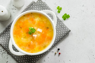 Slow cooker split pea bacon soup in bowl. Top view, copy space, flat lay.