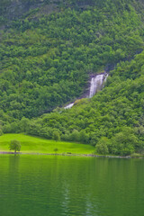 beautiful view of waterfalls and green nature in norway