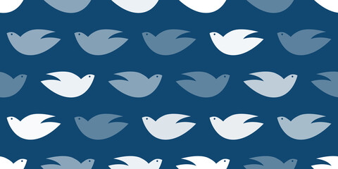 Obraz premium Lots of Simple Bird Shapes, Peace Pigeons of Various Sizes and Shades of Blue - Pattern, Wide Scale Texture - Seamless Background Design, Vector Template