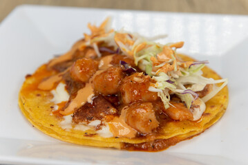 Appetizing shrimp taco with all the great toppings for a tempting Mexican food delicacy