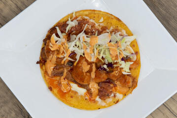 Overhead view of appetizing shrimp taco with all the great toppings for a tempting Mexican food delicacy