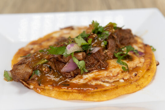 Appetizing Birria Taco With All The Toppings  For A Tempting Mexican Food Delicacy