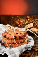 Classic Cookies with chocolate chips on a red background. Close-up. Traditional dessert. shortcrust pastry. High quality photo