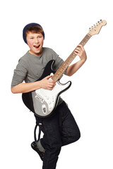 Obraz premium Rockin out. A teenage boy playing a n electric guitar.