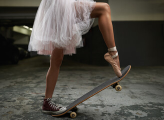 I have many talents. A cropped image of a woman on a skateboard wearing one sneakers and a ballet slipper.
