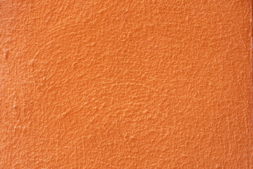 Fototapeta premium Empty orange concrete stain wall with weathered condition. ideal for background or wallpaper for vintage and grunge concept.