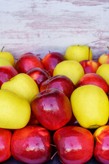 Red and yellow apples placed in a container box and with copy space.