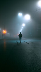 silhouette of a person in the fog