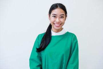 Female asian doctor or nurse in green uniform look at camera standing in patient Clean and room with a bed in the new medical center. Healthcare medical and medicine concept.