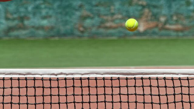 Super slow motion of tennis player hitting the ball. Close-up of forehand hit. Filmed on high speed cinema camera, 1000fps.