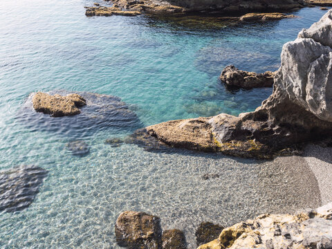 Mediterranean coast cove with turquoise waters in Manilva, Costa del Sol, Spain
