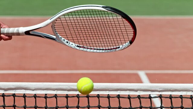 Super slow motion of tennis player hitting the ball. Close-up of forehand hit. Filmed on high speed cinema camera, 1000fps.